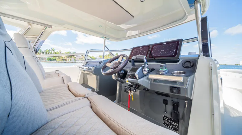  Yacht Photos Pics Luxurious YOT 36 boat interior, 2025 model, featuring advanced navigation systems and plush seating.