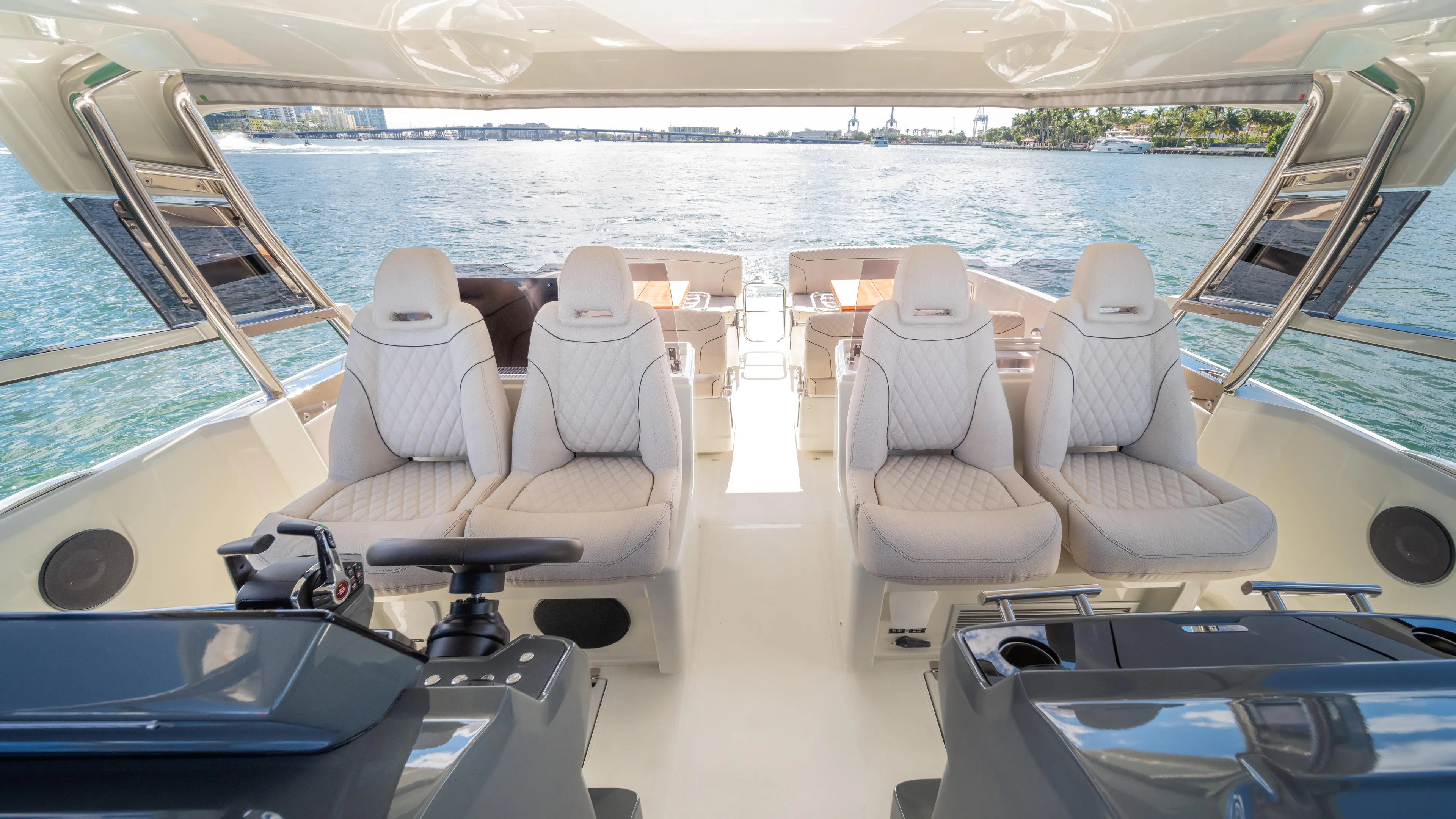  Yacht Photos Pics Luxurious 2025 YOT 36 yacht interior with plush seating and panoramic ocean view.