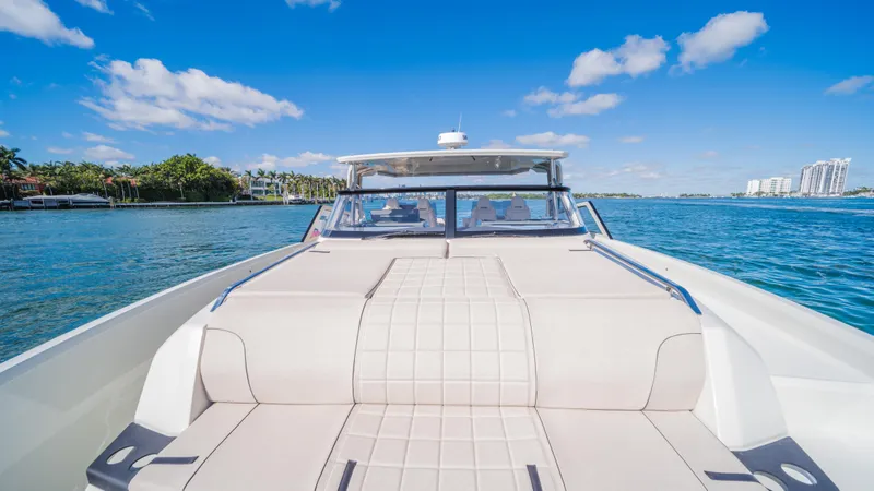  Yacht Photos Pics 2025 YOT 36 boat on water, clear sky, luxurious seating, scenic view.