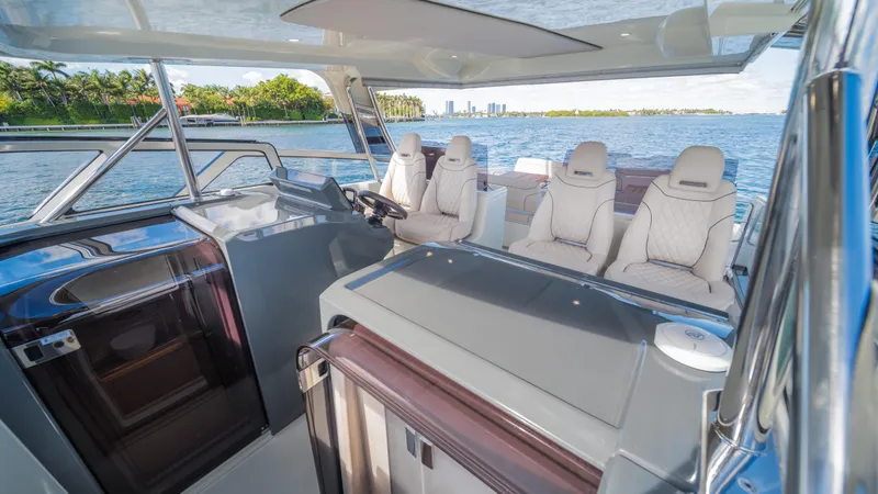  Yacht Photos Pics Luxurious 2025 YOT 36 boat interior with plush seating and scenic water view.