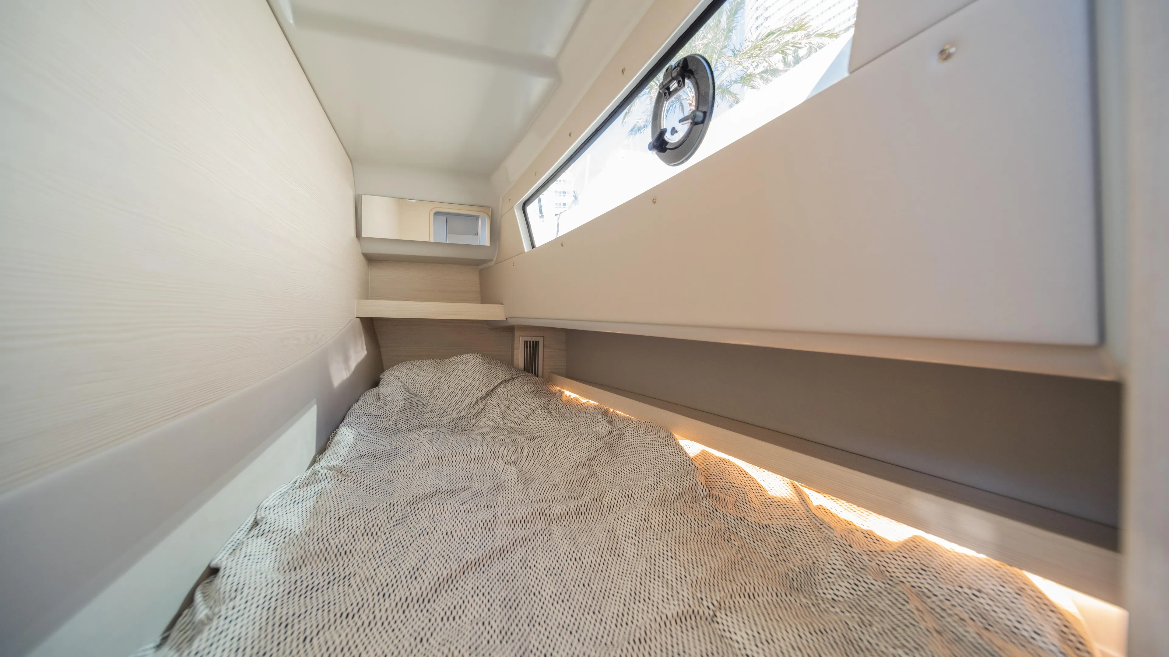  Yacht Photos Pics Cozy interior cabin of 2025 YOT 36 boat with window and bedding.