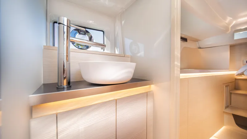  Yacht Photos Pics Modern bathroom interior of 2025 YOT 36 yacht with sleek sink and minimalist design.
