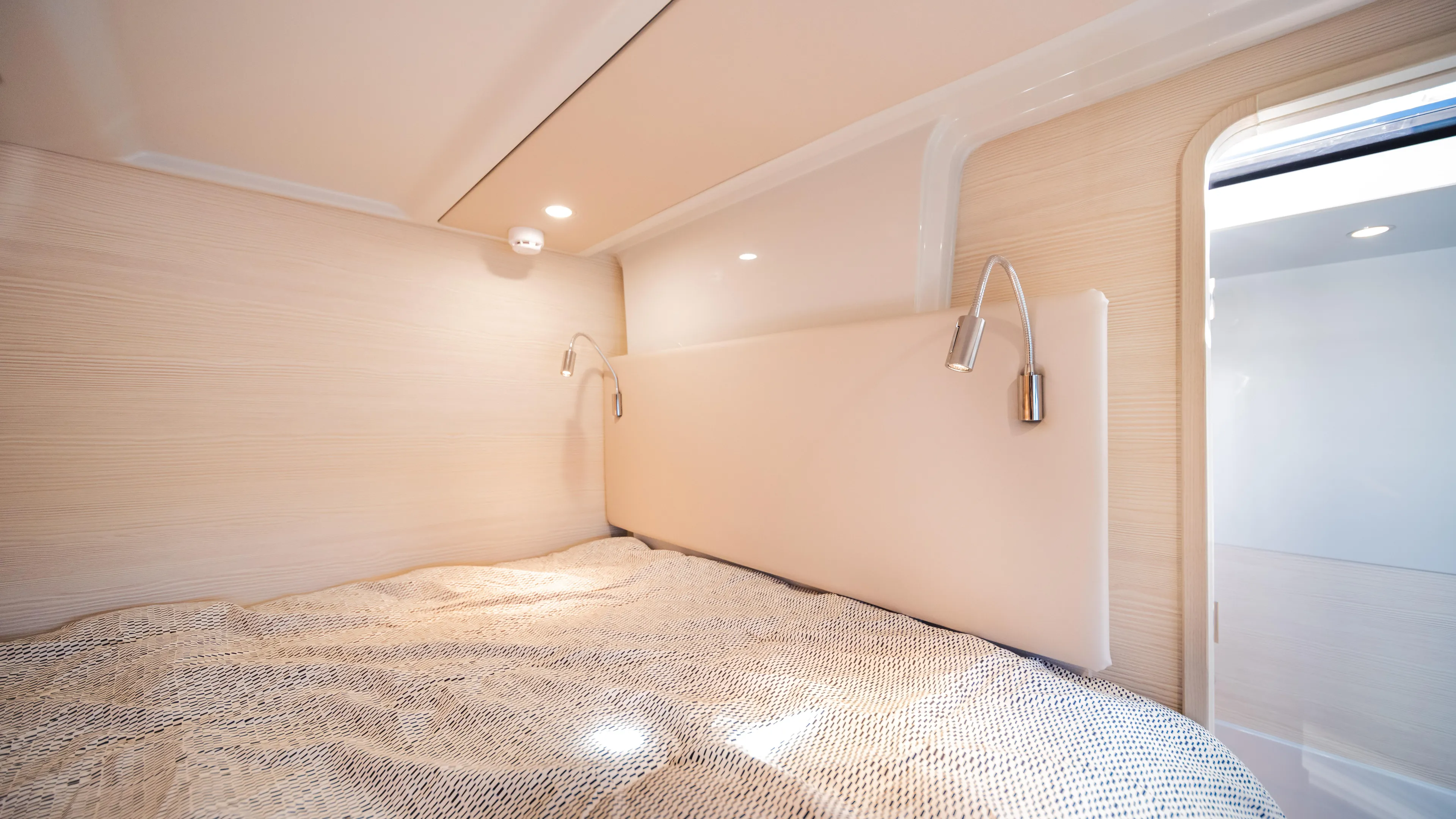  Yacht Photos Pics Cozy bedroom interior of 2025 YOT 36 yacht with modern lighting and elegant design.
