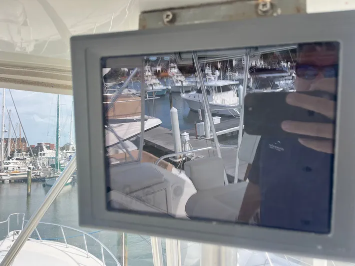 Series 60, Repainted Yacht Photos Pics Reflection on a screen aboard a 2000 Ocean Yachts 48 Convertible.