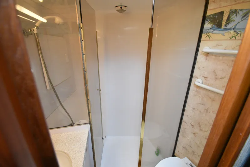 Series 60, Repainted Yacht Photos Pics Shower in Ocean Yachts 48 Convertible, year 2000.