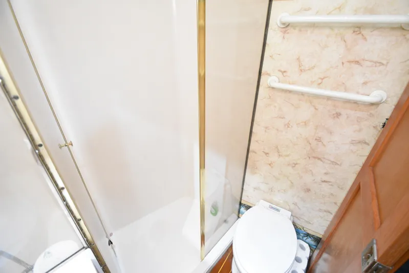 Series 60, Repainted Yacht Photos Pics Bathroom of Ocean Yachts 48 Convertible 2000 with shower and toilet.