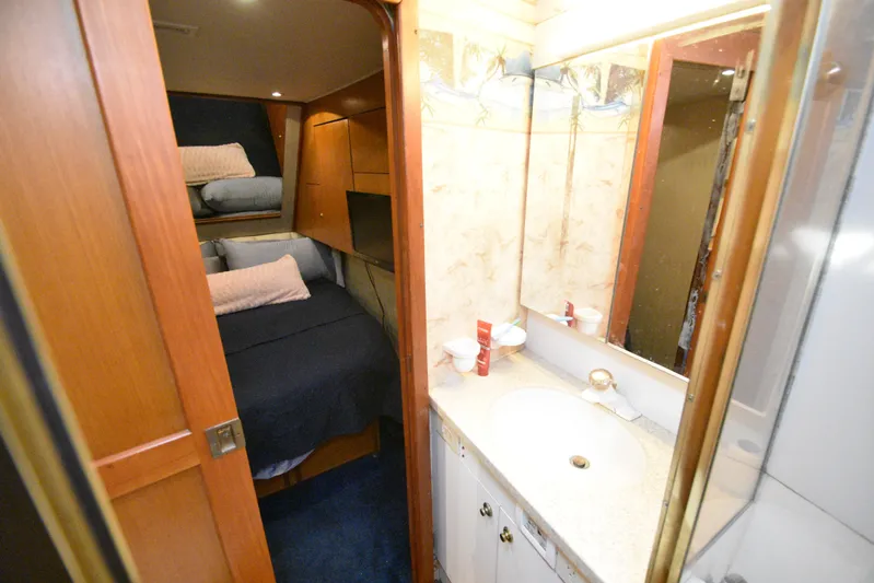 Series 60, Repainted Yacht Photos Pics Interior of 2000 Ocean Yachts 48 Convertible with bathroom and sleeping area.