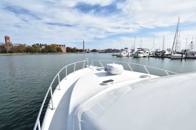 Series 60, Repainted Yacht Photos Pics Ocean Yachts 48 Convertible 2000 in harbor with city view.