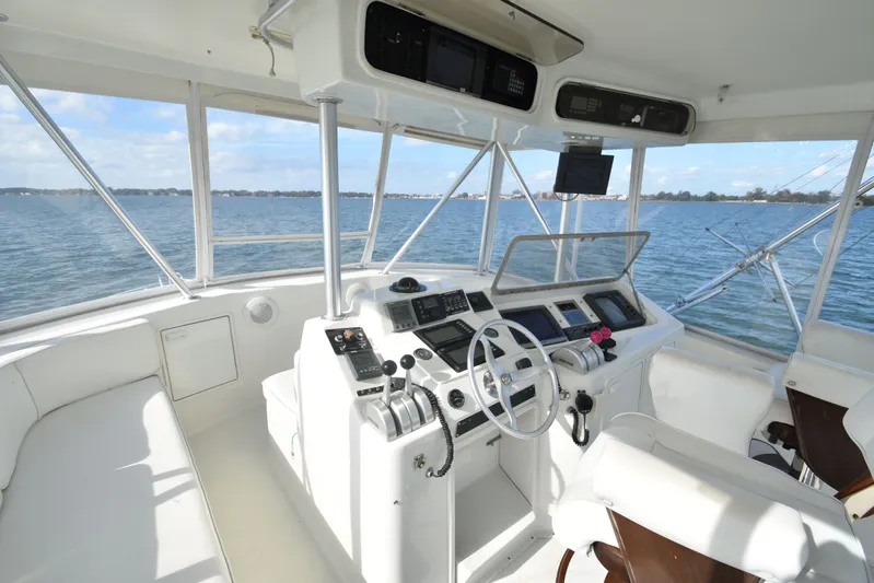 Series 60, Repainted Yacht Photos Pics Helm of a 2000 Ocean Yachts 48 Convertible on open water.