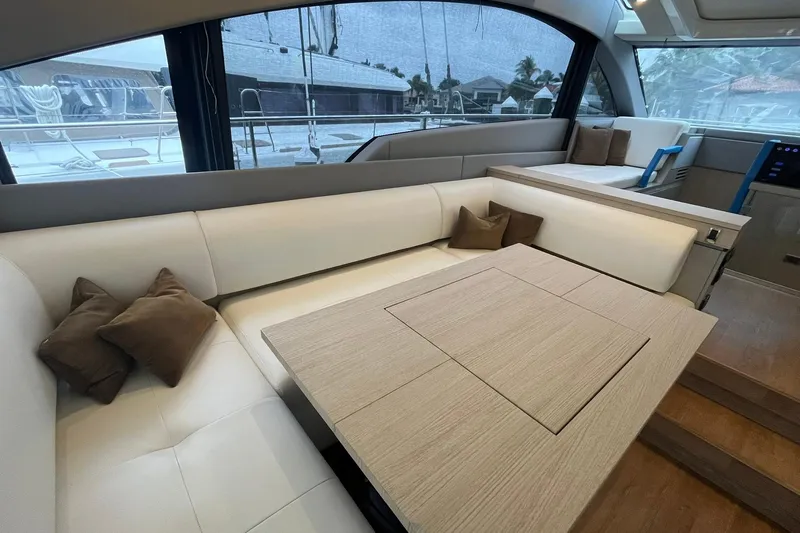  Yacht Photos Pics Luxurious interior of 2012 Fairline Targa 58 Gran Turismo yacht with elegant seating and table.
