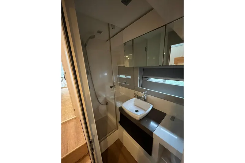  Yacht Photos Pics Bathroom interior of 2012 Fairline Targa 58 Gran Turismo yacht, featuring modern sink and shower.