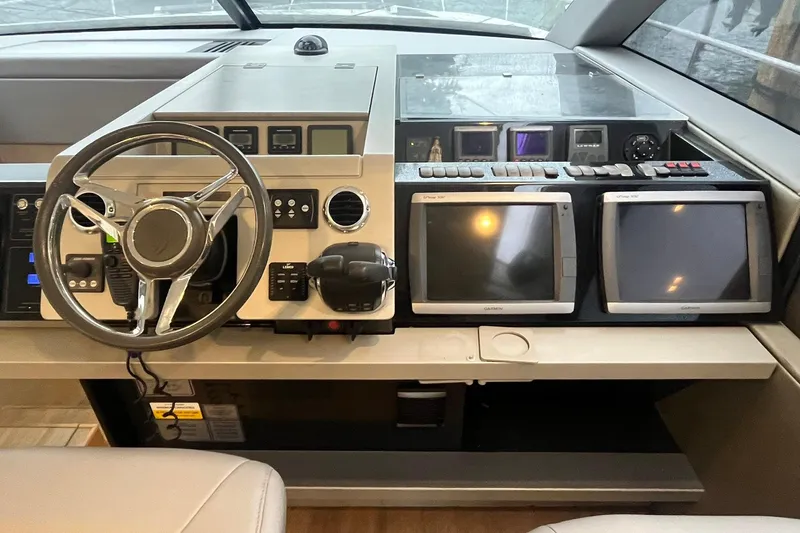  Yacht Photos Pics Cockpit of 2012 Fairline Targa 58 Gran Turismo with steering wheel and navigation screens.