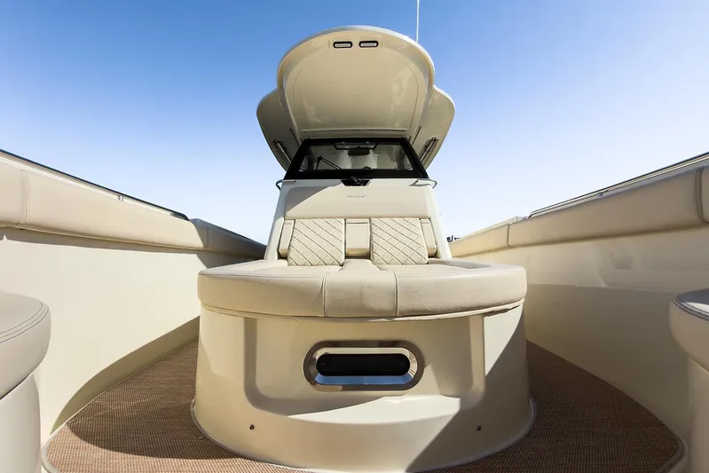 Our Trade Yacht Photos Pics 2019 Chris-Craft Catalina 30 boat interior with beige seating and clear blue sky.