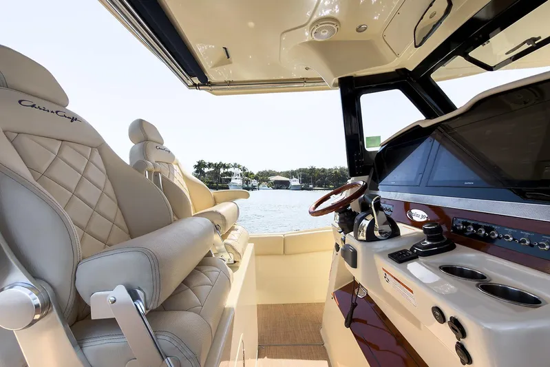 Our Trade Yacht Photos Pics 2019 Chris-Craft Catalina 30 interior with luxurious seating and modern dashboard.