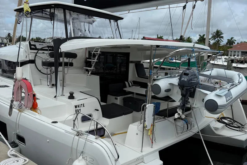 Jelliblu Yacht Photos Pics 2019 Lagoon 42 catamaran docked, featuring spacious deck and modern amenities.