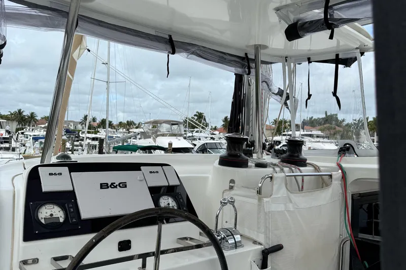 Jelliblu Yacht Photos Pics Cockpit view of 2019 Lagoon 42 catamaran with B&G navigation system in a marina.