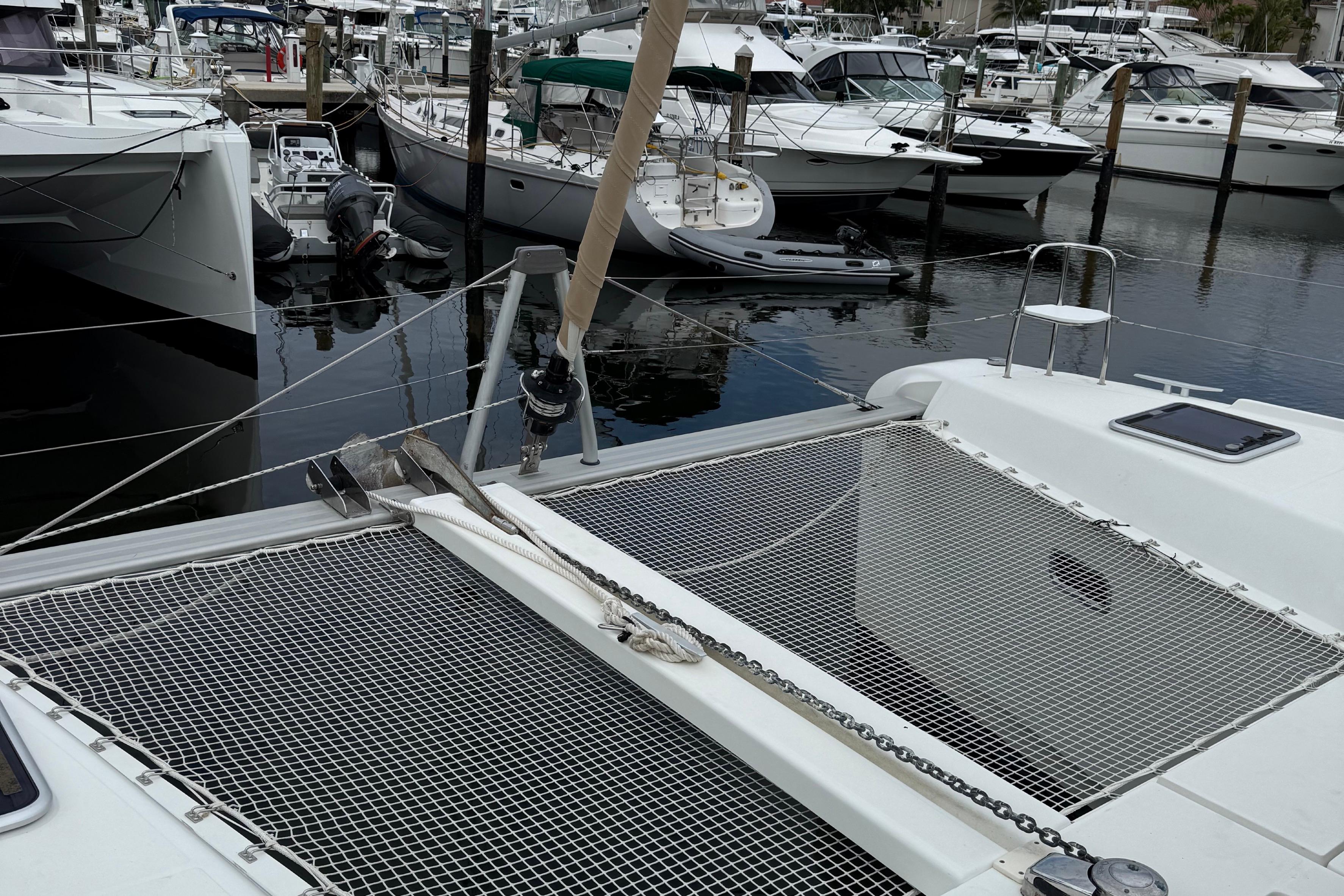 2019 Lagoon 42 catamaran docked in a marina with other boats.