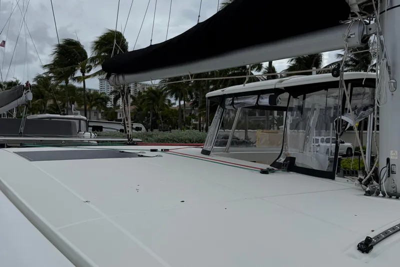 Jelliblu Yacht Photos Pics 2019 Lagoon 42 catamaran docked, featuring sleek design and modern rigging.