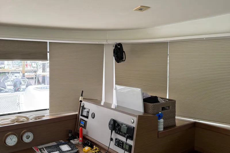 Jelliblu Yacht Photos Pics Interior of 2019 Lagoon 42 yacht with navigation equipment and closed blinds.