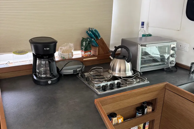 Jelliblu Yacht Photos Pics Kitchen area in 2019 Lagoon 42 yacht with coffee maker, kettle, and toaster oven.