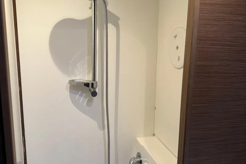 Jelliblu Yacht Photos Pics Shower area inside 2019 Lagoon LAGOON 42 yacht, featuring modern fixtures.
