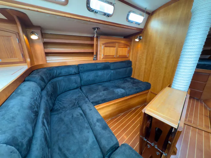 Ulrica Yacht Photos Pics Luxurious interior of 1997 Sabre 402 yacht with plush seating and wooden finishes.