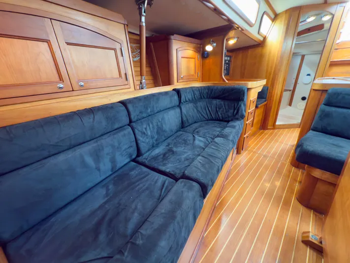 Ulrica Yacht Photos Pics Luxurious interior of a 1997 Sabre 402 yacht with plush seating and wooden finishes.
