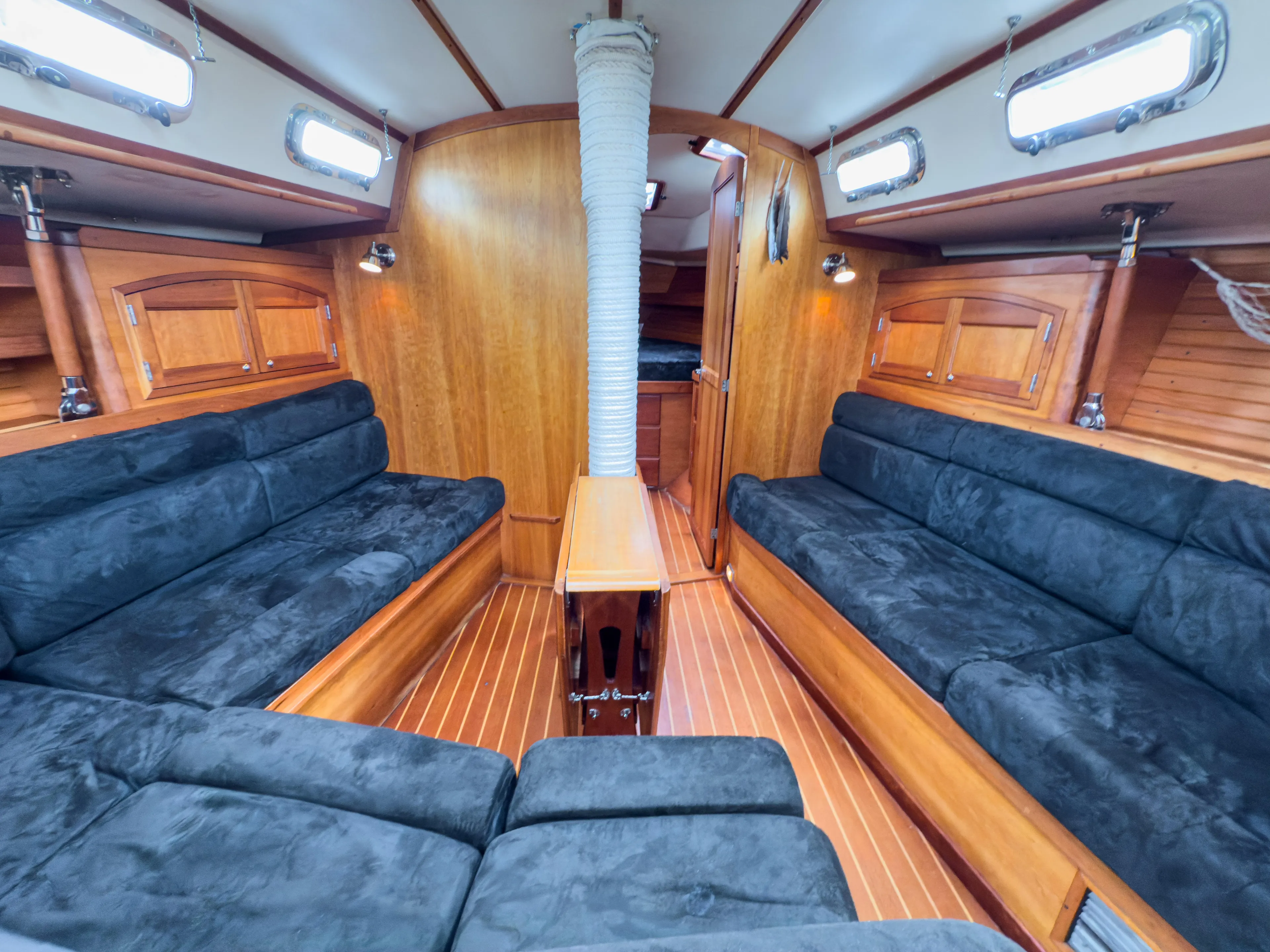 Ulrica Yacht Photos Pics Interior of 1997 Sabre 402 sailboat with wooden finish and plush seating.
