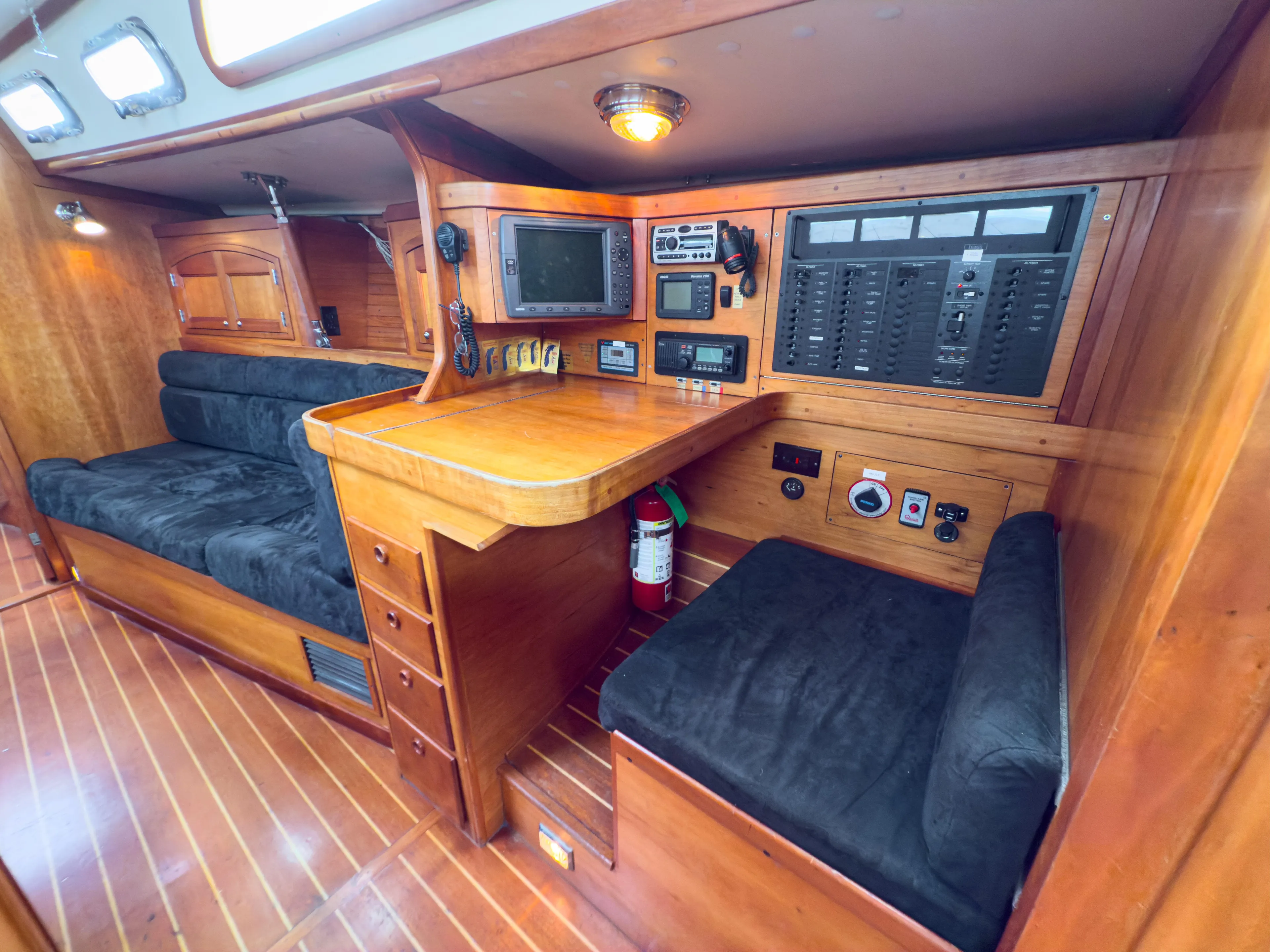 Ulrica Yacht Photos Pics Interior of 1997 Sabre 402 sailboat with navigation station and seating area.