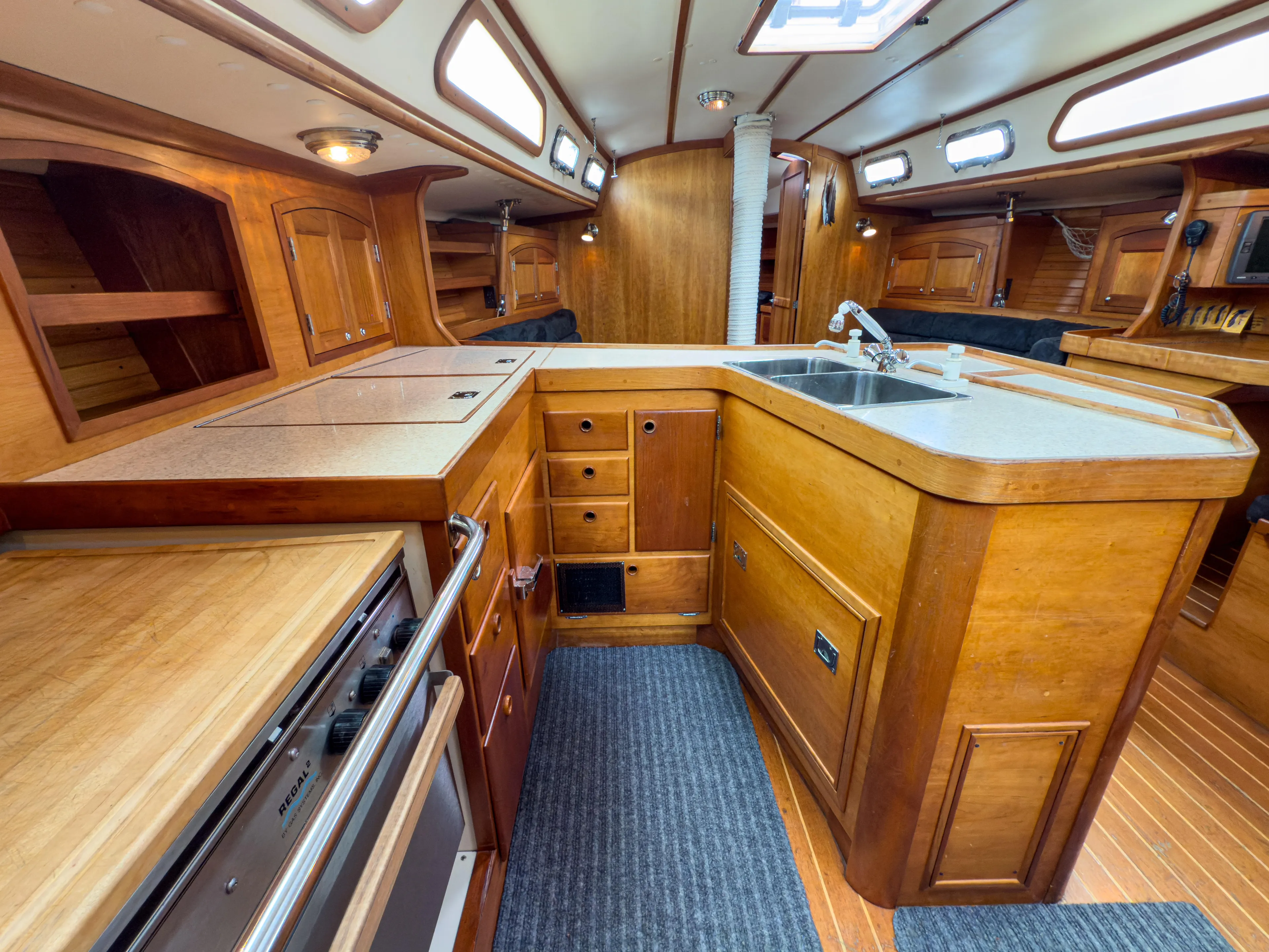 Ulrica Yacht Photos Pics Spacious 1997 Sabre 402 yacht interior with wooden cabinetry and modern kitchen amenities.