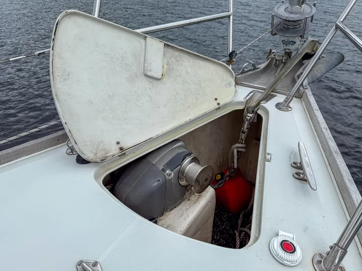 Ulrica Yacht Photos Pics Open anchor locker on 1997 Sabre 402 sailboat, showing anchor chain and windlass.