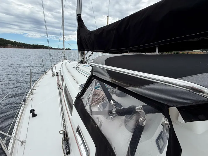 Ulrica Yacht Photos Pics Sailing yacht Sabre 402, 1997 model, on calm waters under a cloudy sky.