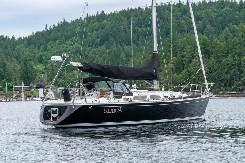 Ulrica Yacht Photos Pics Sailing yacht Sabre 402, 1997 model, anchored in scenic forested bay.