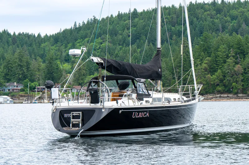 Ulrica Yacht Photos Pics Sailboat Sabre 402, 1997 model, anchored in a scenic forested bay.