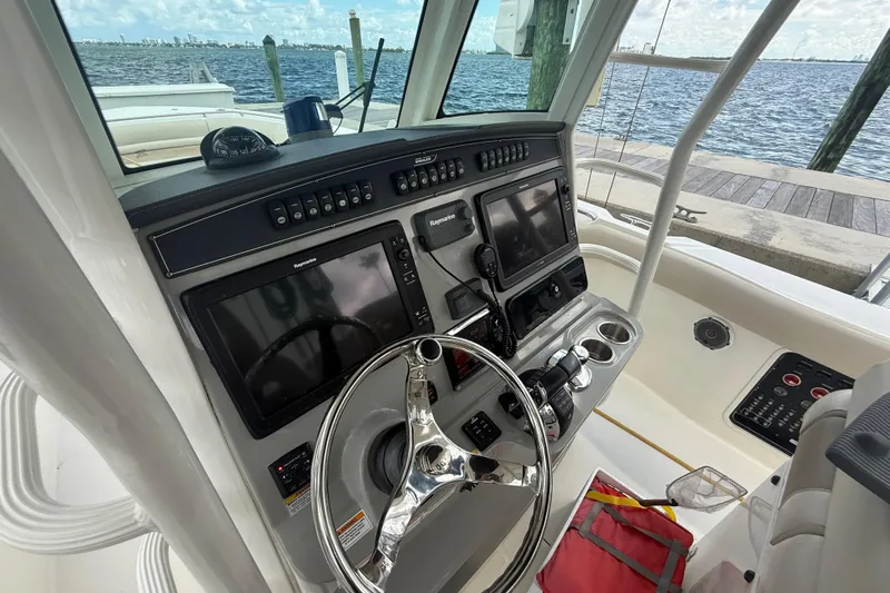 Dulce Vita Yacht Photos Pics 2016 Boston Whaler 330 Outrage helm with advanced navigation systems and ocean view.