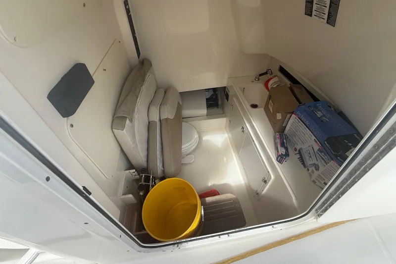 Dulce Vita Yacht Photos Pics Interior cabin of 2016 Boston Whaler 330 Outrage with storage and seating.