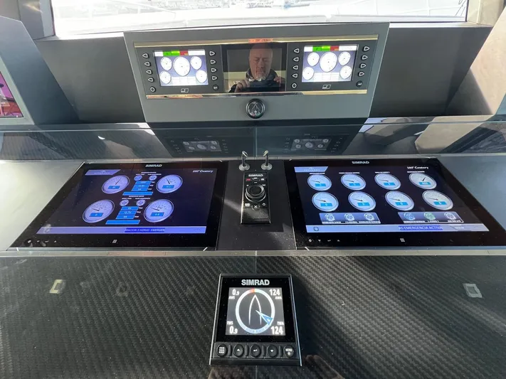 Armaar Yacht Photos Pics Control panel of 2017 Astondoa AS100 Century yacht with digital displays and navigation system.