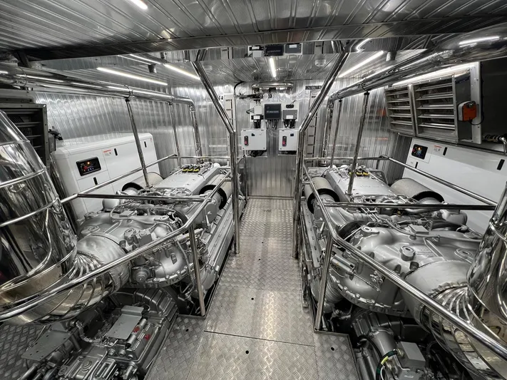 Armaar Yacht Photos Pics Engine room of 2017 Astondoa AS100 Century yacht, featuring dual engines and metallic finishes.