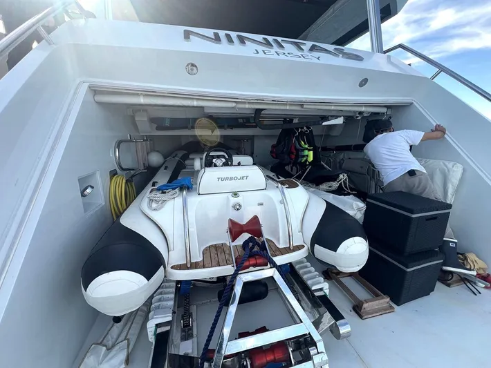 Armaar Yacht Photos Pics Astondoa AS100 Century 2017 yacht with Turbojet tender in storage compartment.