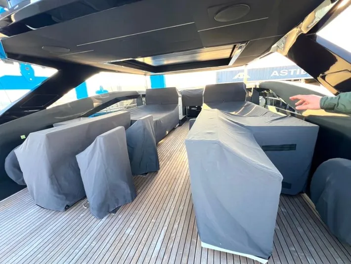 Armaar Yacht Photos Pics Covered deck area of 2017 Astondoa AS100 Century yacht with wooden flooring.