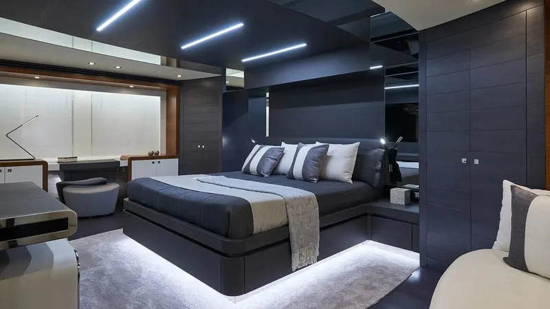 Armaar Yacht Photos Pics Luxurious bedroom interior on 2017 Astondoa AS100 Century yacht, featuring modern design and ambient lighting.