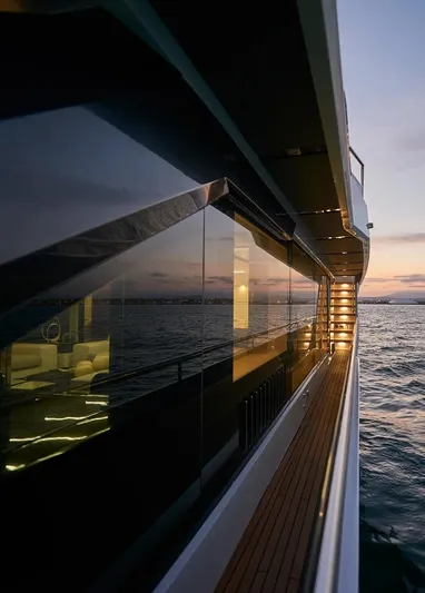 Armaar Yacht Photos Pics Astondoa AS100 Century 2017 yacht at sunset, reflecting ocean views on sleek windows.
