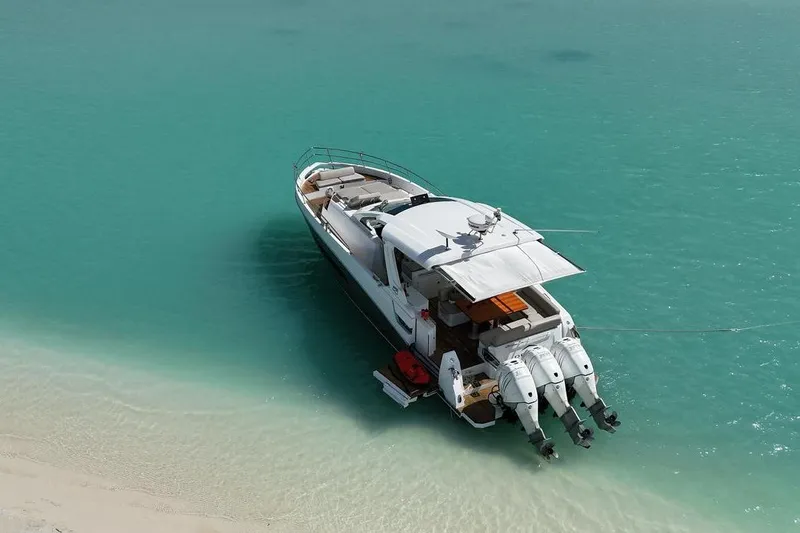 2017 Azimut Verve 40 @ Cancun Yacht Photos Pics Azimut Verve 40 yacht, 2017 model, anchored in clear turquoise water near a sandy beach.