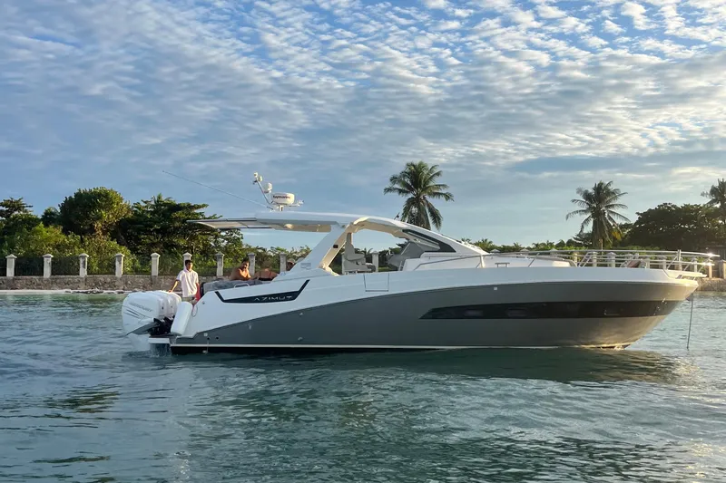 2017 Azimut Verve 40 @ Cancun Yacht Photos Pics 2017 Azimut Verve 40 yacht cruising on serene waters with palm trees in the background.