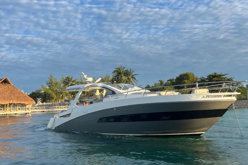 2017 Azimut Verve 40 @ Cancun Yacht Photos Pics 2017 Azimut Verve 40 yacht cruising near tropical shoreline under blue sky.