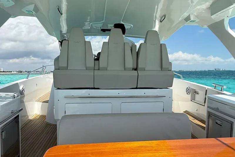 2017 Azimut Verve 40 @ Cancun Yacht Photos Pics 2017 Azimut Verve 40 yacht interior with seating, ocean view, and clear skies.