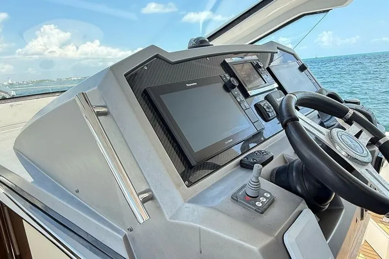 2017 Azimut Verve 40 @ Cancun Yacht Photos Pics Cockpit of 2017 Azimut Verve 40 yacht with navigation controls and ocean view.
