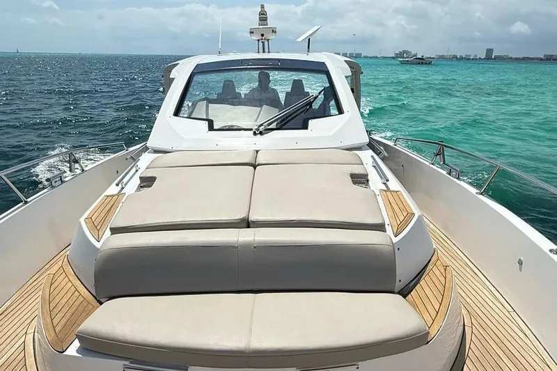 2017 Azimut Verve 40 @ Cancun Yacht Photos Pics 2017 Azimut Verve 40 yacht cruising on turquoise waters under a cloudy sky.