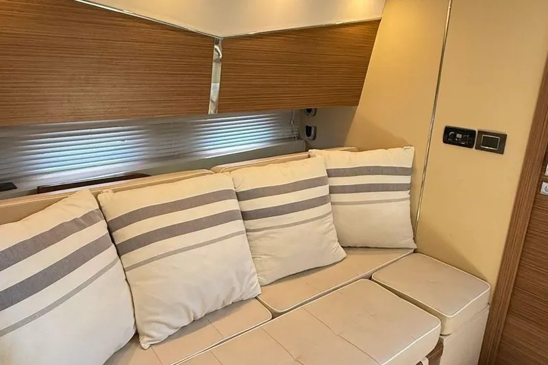 2017 Azimut Verve 40 @ Cancun Yacht Photos Pics Interior of 2017 Azimut Verve 40 yacht with striped cushions and modern design.