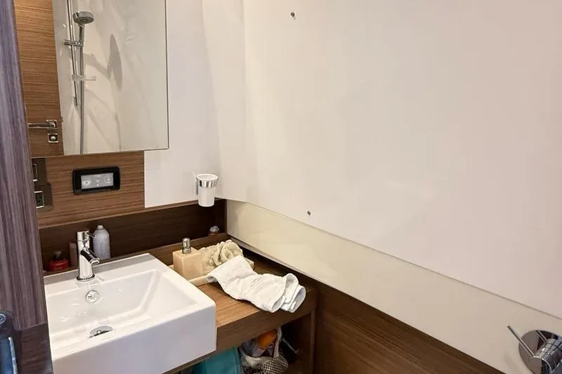 2017 Azimut Verve 40 @ Cancun Yacht Photos Pics Bathroom interior of 2017 Azimut Verve 40 yacht with modern sink and wooden accents.